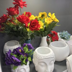 White Ceramic Face Vase with Faux Floral Arrangement